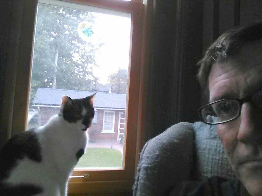 Social Studies teacher Tom Warnke and one of his beloved cats