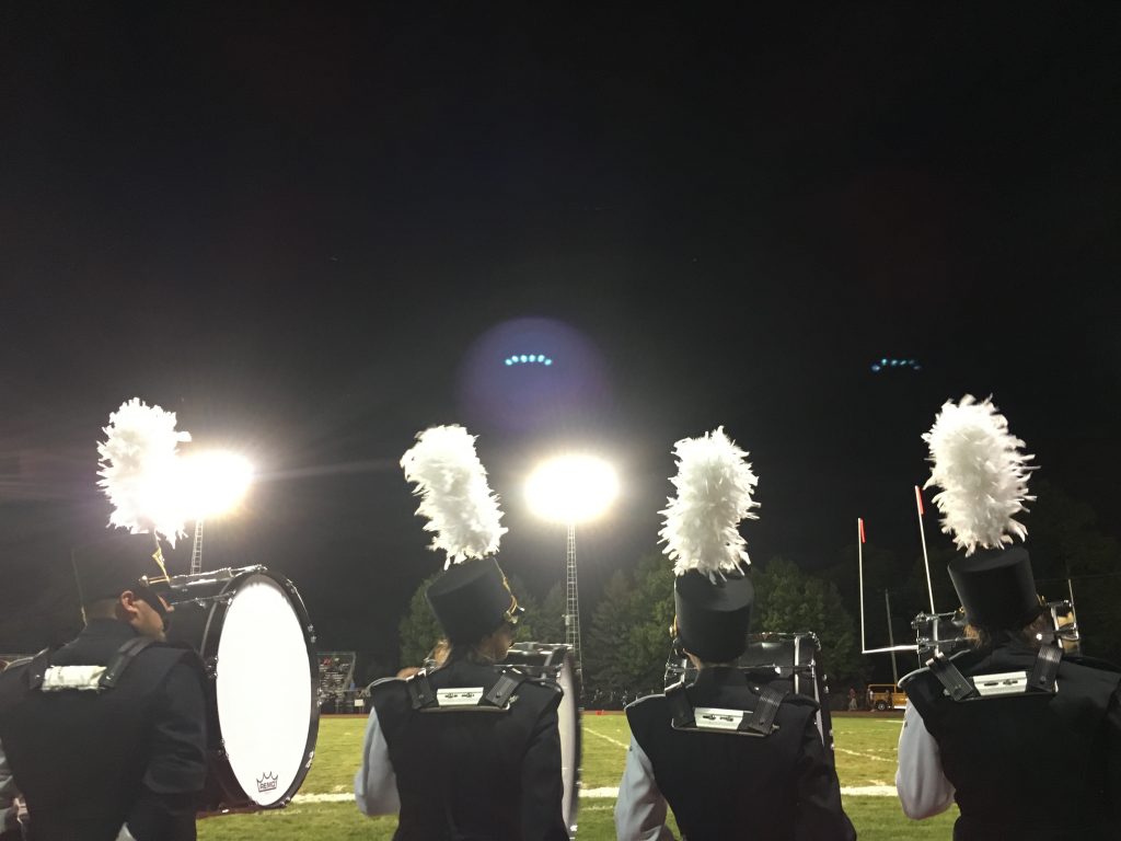 Drummers face the field after the bands performance.