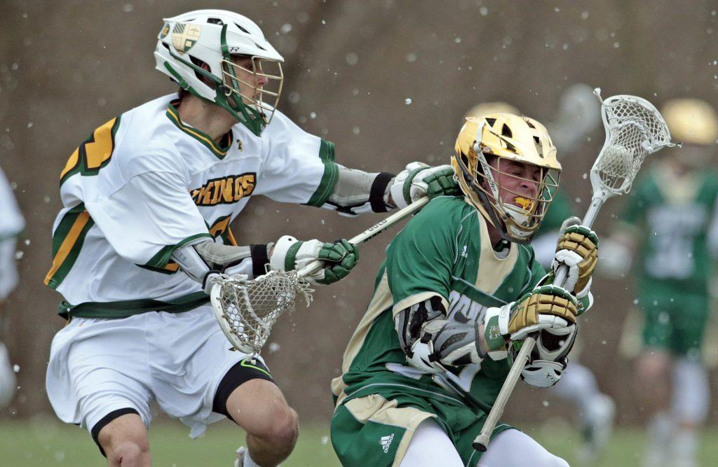 Senior Hunter Krauss shields the ball from a Central Catholic defender during a game at Iron Lakes. Photo courtesy of The Morning Call.