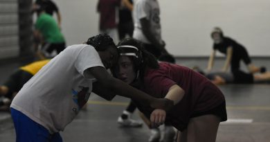 Female student shines on wrestling team Female student shines on wrestling team