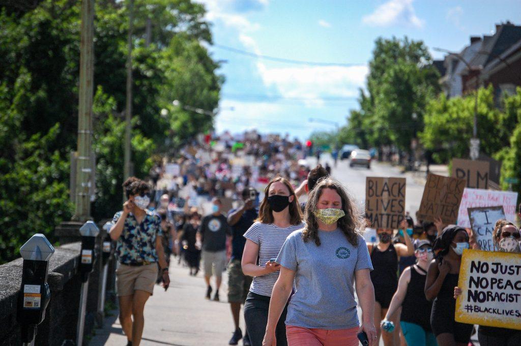 Protesters march from Bethlehem Rose Garden Park to the Bethlehem Public Library with signs in hand and masks in place, chanting “No justice, no peace,” “Say his name-- George Floyd,” and “Black Lives Matter” along the way. Photo by Meliha Anthony.
