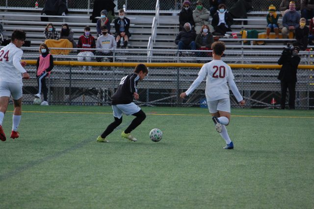 Senior Josh Miller dribbles the ball during the District XI Quarterfinal on Oct. 31 against Whitehall. Photo by Meliha Anthony.