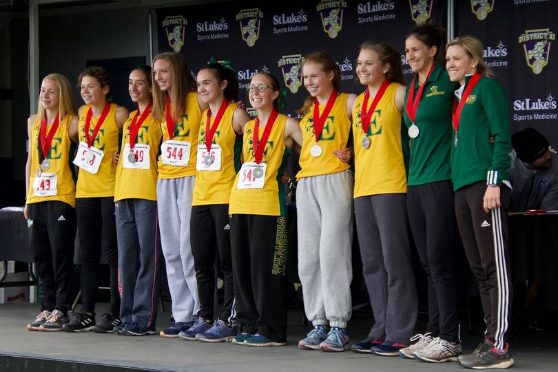 Cross+crountry+runners+pose+after+winning+first+place+in+the+2018+District+11+championship+meet+with+coaches%0AKelly+Bracetty+%28second+from+right%29+and+Kami+Reinhard.%28far+right%29.+Bracetty%E2%80%99s+contract+was+not+renewed.%0AContributed+photo.