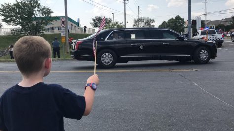 Jonathan Shreck, who will be a kindergartner this year at Macungie Elementary School, waves a flag at President Joe Biden after the presidents tour of Mack Trucks on July 28. Photo courtesy of Jeff Shreck.