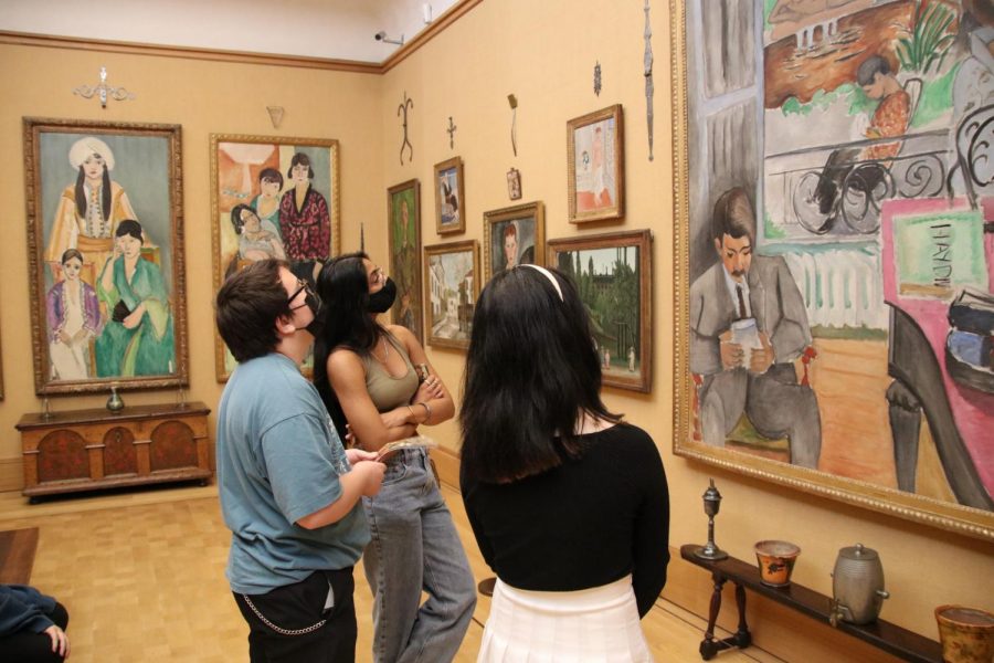 Art students on the department’s field trip comment on artworks in the Barnes Foundation. The museum features a variety of works from different time periods, places, styles, mediums, and artists. Photo by Beth Brown.