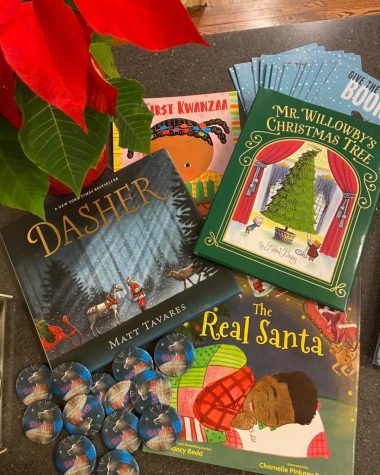 Books such as Dasher: How a Brave Little Doe Changed Christmas Forever and The Real Santa feature more diverse holiday stories. Photo by Maddie Hess.