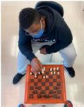 Franklin Smith-Fullwood, an officer of Chess Club, plays against another student. Photo by Devon Helmer.
