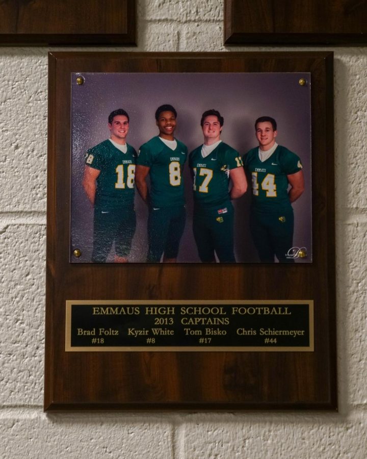 A plaque rests in the EHS weight room depicting Kyzir White and his fellow team
captains in 2014. Photo by Alice Adams.