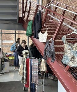 Student shoppers rummage through the Thrift Shift in the auditorium elevator lobby at Emmaus High School. Photo by Anna Smith. 