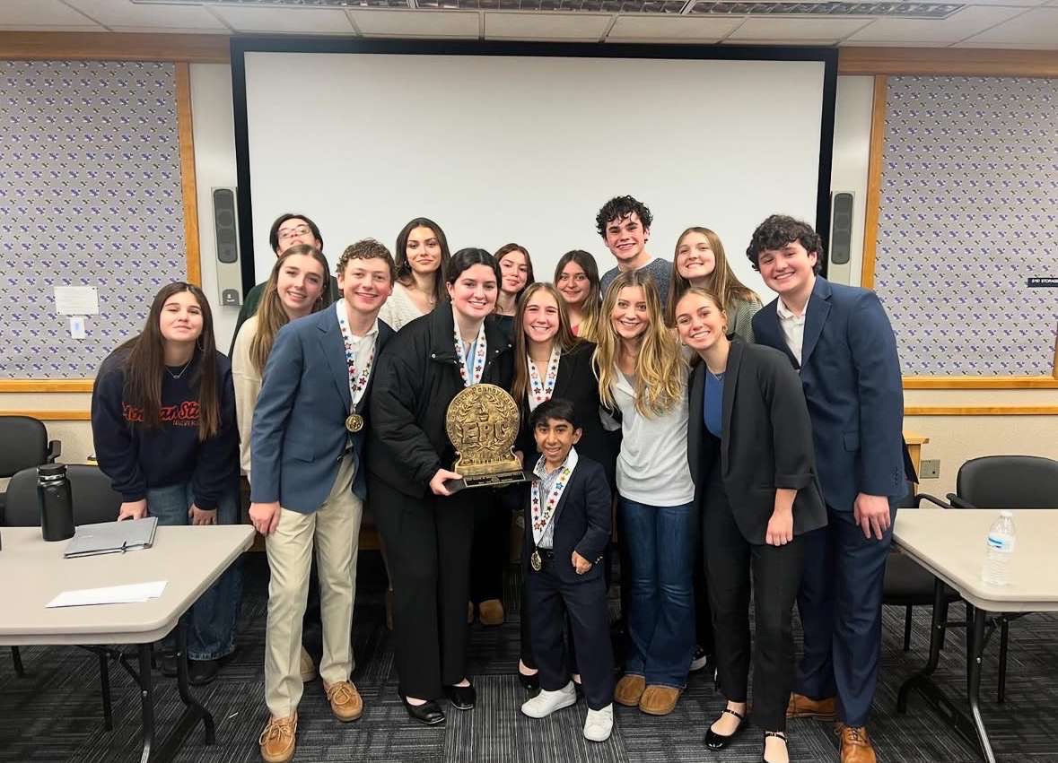 Photo of Emmaus High School Debate Team with their award.