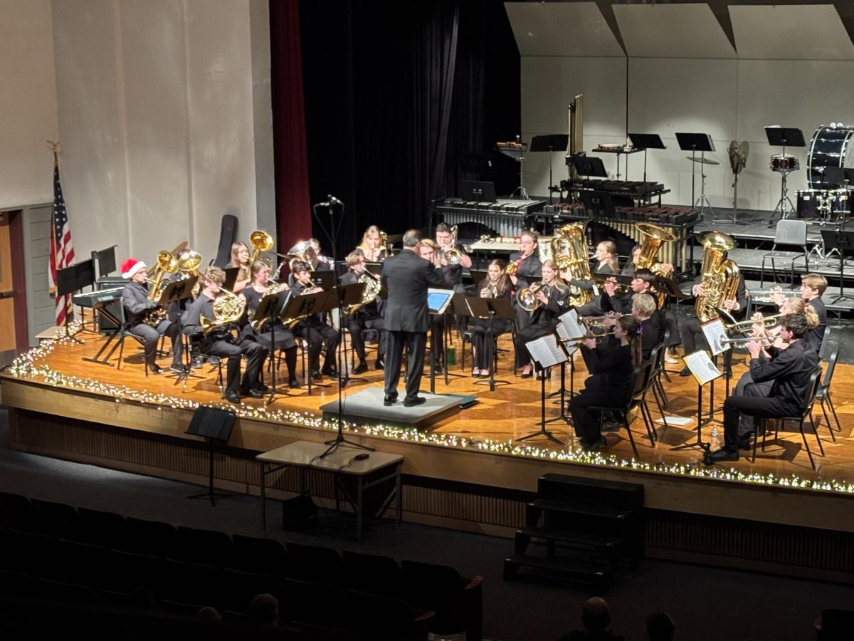 Koppenol conducts the brass ensemble at Winter Concert. Photo by Gabbie Walter.