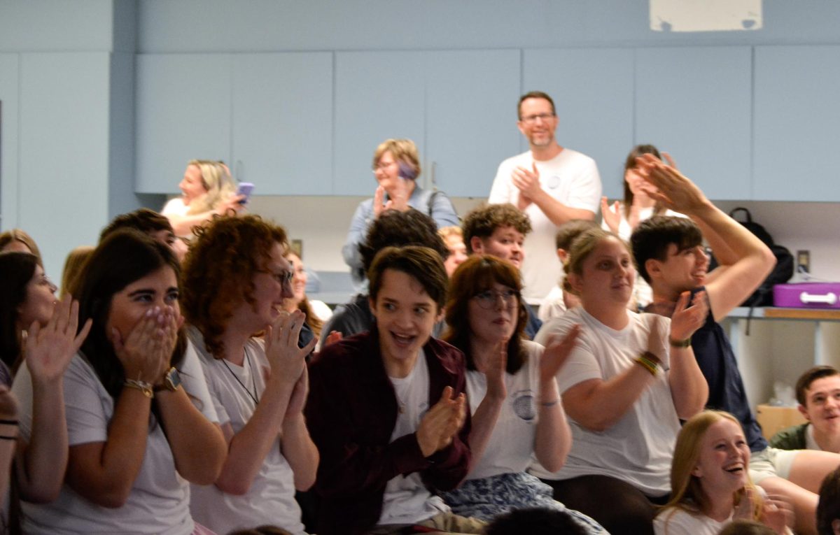Theater Department advisors and cast celebrate Mamma Mia!’s nomination for best overall production of a musical. Photo by Gabe Meyers.