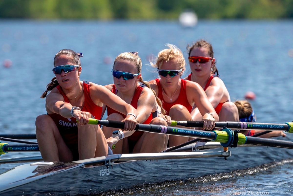 Pechulis, third back, rows along with team. Photo courtesy of Pechulis.