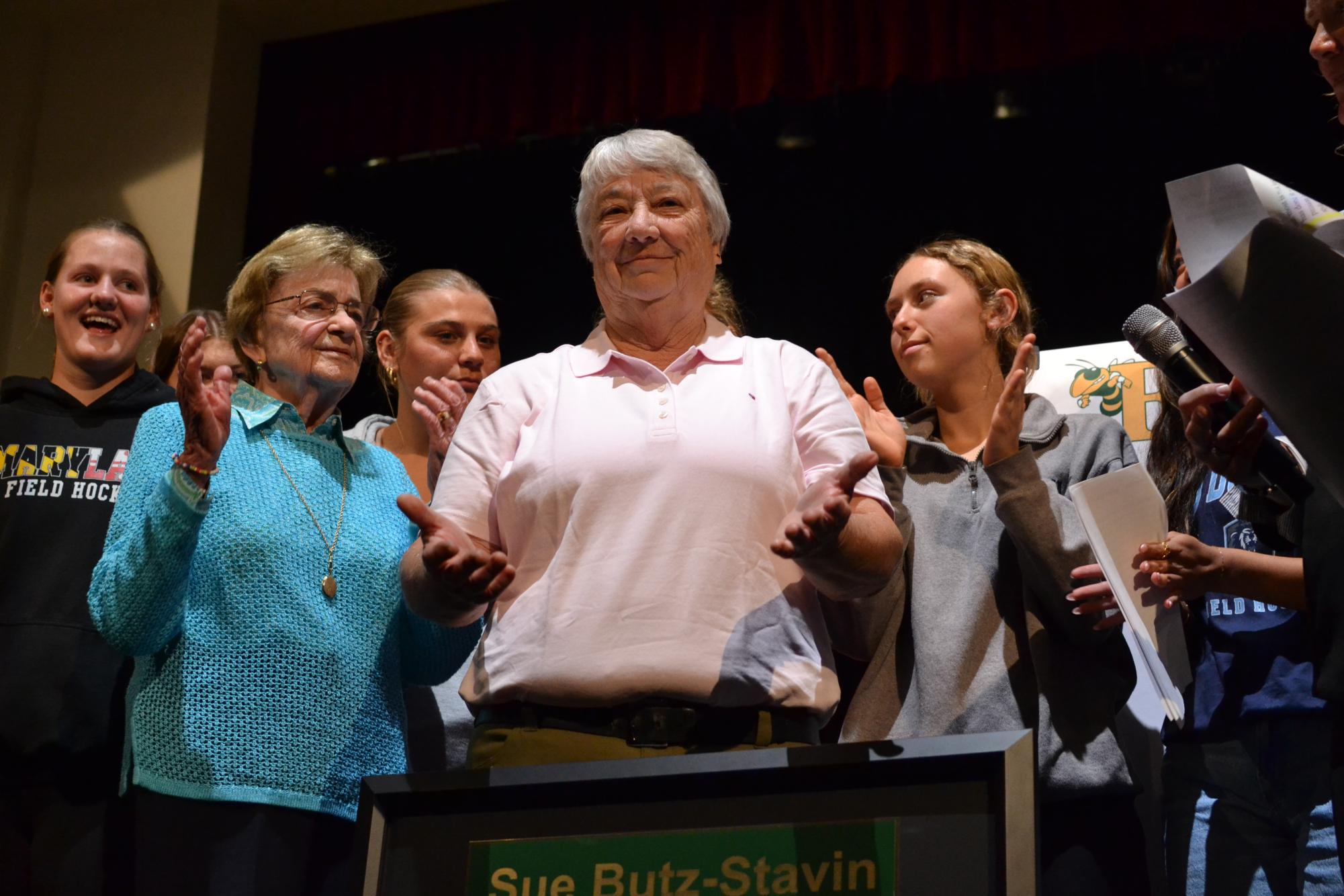 Field Hockey Coach Sue Butz-Stavin and players on the team stand alongside one another after being recognized during the student athletes announcement day ceremony. Photo by Thiffany Ceolin-Reimao. 